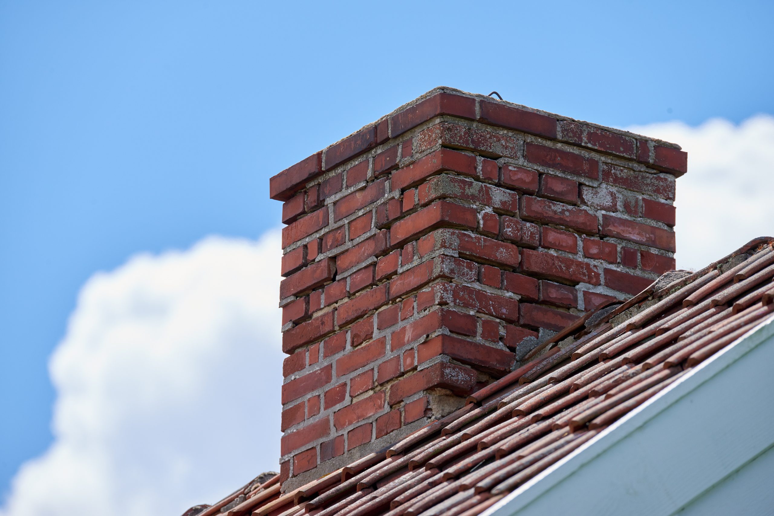 Chimney in need of repair Brick chimney stack in need of repair, cracked mortar visible